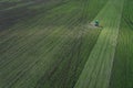 Aerial view of a young beetroot field and a tractor spraying fertilizer Royalty Free Stock Photo