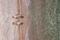 Aerial view on a young couple lying on the beach Royalty Free Stock Photo