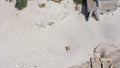 Aerial view of a young couple lying on the white sand. man and woman spend time together and travel through the desert Royalty Free Stock Photo