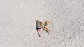 Aerial view of a young couple lying on the white sand. man and woman spend time together and travel through the desert Royalty Free Stock Photo