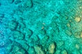 Aerial view of a young couple snorkeling above coral reef reaching deeper parts of the crystal clear water, Rhodes, Greece. Aerial Royalty Free Stock Photo