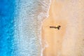 Aerial view of the young lying woman on the sandy beach near sea Royalty Free Stock Photo