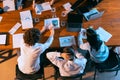 Aerial view of young multiethnic people talking, working with colleagues, co-workers at office, indoors. Work, finance Royalty Free Stock Photo