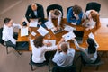 Aerial view of young multiethnic people talking, working with colleagues, co-workers at office, indoors. Work, finance Royalty Free Stock Photo