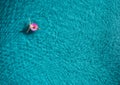 Aerial view of young woman swimming on the pink swim ring Royalty Free Stock Photo