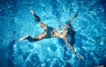 Aerial view of Young woman swimming underwater in the pool Royalty Free Stock Photo