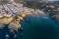 Aerial view of the Zambujeira do Mar village and beach at sunset, in Alentejo