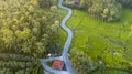 Aerial view of zigzag road through rice fields