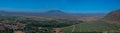 Aerial view of the Zomba Plateau with vineyards and rural neighbourhood with Mount Mulanje in the background