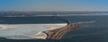 Aerial view of ÃËresund Oresund Bridge toward Sweden, during a winterly day with parts of baltic sea frozen