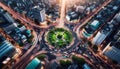 Aerial views of a busy city roundabout with lighted traffic roads. Royalty Free Stock Photo