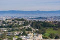 Aerial views of residential areas of San Francisco, San Francisco bay, Oakland and industrial areas in the background, California Royalty Free Stock Photo