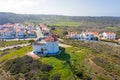 Aerial from the village Carapateira on the westcoast in Portugal with an old traditional windmill Royalty Free Stock Photo