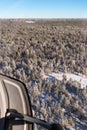 Aerial vision from helicopter seeing landscape of trees full of snow Royalty Free Stock Photo