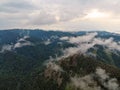 Aerial viw of fog among the mountain peaks. Bad weather and fog in the Siberian nature reserve Stolby.