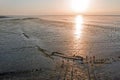 Aerial from walking on the mud from the Wadden Sea with an old ship wreck in Friesland the Netherlands at sunset Royalty Free Stock Photo