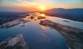 Aerial, west view of Zambezi river, mountains and african wilderness. Colorful sunset reflecting on huge  Zambezi river, view from Royalty Free Stock Photo