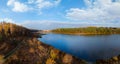 Aerial wide view of lake shore at sunrise in autumn. Meadows, orange grass, trees. Colorful landscape of river sunset. Horodok Royalty Free Stock Photo