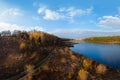 Aerial wide view of lake at sunrise in autumn. Meadows, orange grass, trees. Colorful landscape of river sunset. Horodok Ukraine Royalty Free Stock Photo