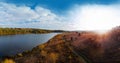 Aerial wide view of lake at sunrise in autumn. Meadows, orange grass, trees. Colorful landscape of river sunset. Horodok Ukraine Royalty Free Stock Photo