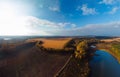 Aerial wide view of lake at sunrise in autumn. Meadows, trees at dawn. Colorful aerial landscape of river coast at sunset in fall Royalty Free Stock Photo