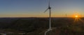 Aerial Wind farm turbines silhouette at sunset. Clean renewable energy power generating windmills. Royalty Free Stock Photo