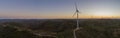 Aerial Wind farm turbines silhouette at sunset. Clean renewable energy power generating windmills. Royalty Free Stock Photo