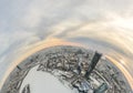 Aerial winter city view with crossroads and roads, houses, buildings, parks and bridges. Copter shot. Little planet sphere mode