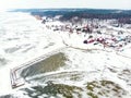 Aerial winter landscape of the Baltic Sea and frozen Curonian Lagoon near the town of Nida Royalty Free Stock Photo