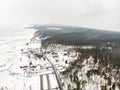 Aerial winter landscape of the Baltic Sea and frozen Curonian Lagoon near the town of Nida Royalty Free Stock Photo