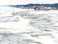 Aerial winter landscape of the Baltic Sea and frozen Curonian Lagoon near the town of Nida Royalty Free Stock Photo