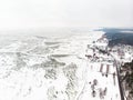 Aerial winter landscape of the Baltic Sea and frozen Curonian Lagoon near the town of Nida Royalty Free Stock Photo