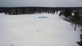 Aerial for winter landscape with pine forest, grey sky and ski track, winter sports game and healthy lifestyle concept