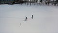 Aerial for winter landscape with pine forest, grey sky and ski track, winter sports game and healthy lifestyle concept