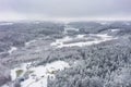 Aerial winter landscape with snowy forest. Poland