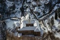 Aerial winter view of Svaty Jan pod Skalou, picturesque little village in Central Bohemia, Czech Republic. Monastery hidden under