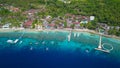 Aerial wooden jetty pier and tourquoise ocean water. Tropical island beach Royalty Free Stock Photo