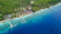 Aerial wooden jetty pier and tourquoise ocean water. Tropical island beach Royalty Free Stock Photo