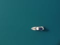 Aerial yacht on calm sea. Luxury cruise trip. View from above of white boat on deep blue water. Aerial top down view of Royalty Free Stock Photo