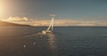 Aerial yacht regatta race at open sea. Amazing seascape of ocean waters at sun reflections