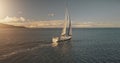 Aerial yacht regatta race at open sea. Amazing seascape of ocean waters at sun reflections