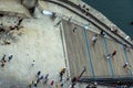 Aerial zenith view of people, tourists and families seen from above walking and taking photos along the Porto promenade of the Dom