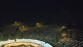 Aerial zoom out of the Srebrenica Memorial Cemetery at night