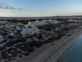 Aeriav view on sandy dunes, beach and Costa Calma, Fuerteventura, Canary islands, Spain in winter on sunset Royalty Free Stock Photo