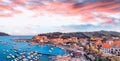 Aerila view of Marina di Campo coastline at sunset, Elba Island - Italy