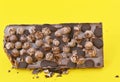 Aero Bubbly Milk Chocolate on yellow background Royalty Free Stock Photo