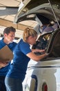 Aero Engineer And Apprentice Working On Helicopter In Hangar Royalty Free Stock Photo