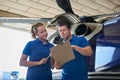 Aero Engineer And Apprentice Working On Helicopter In Hangar Loo Royalty Free Stock Photo