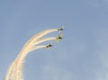 Aerobatic airplane pilot Jurgis Kairys training in the sky of the city. Colored airplane with trace smoke, airbandits, aeroshow Royalty Free Stock Photo