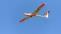 Aerobatic glider on blue sky, withe wings sport team Royalty Free Stock Photo